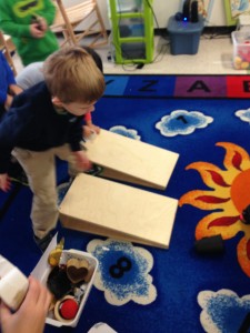 testing out objects (shapes) in our classroom to determine which rolled the farthest