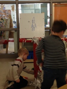 check out the plan we made for our spaceship in the backround