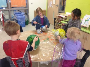 painting some of the plants and sun we made