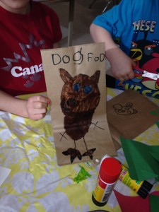 Making a bag of 'dog food' to sell at our pet shop