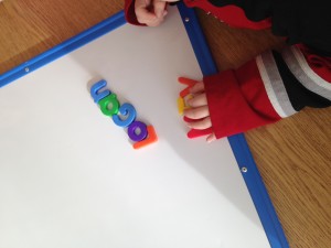 using magnetic letters to spell my name