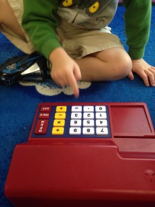 Having fun exploring numbers on our cash register! 