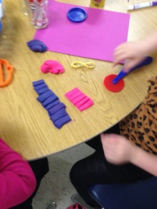 Cutting my playdough in to equal size pieces 