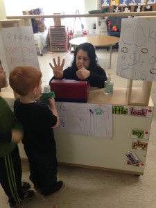 buying our snack and adding our total ($4.00 for cookies + $1.00 for juice= $5.00)