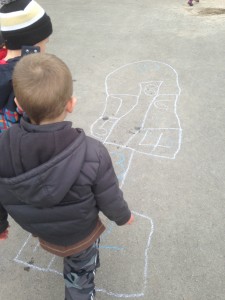doing some math outside playing hop-scotch