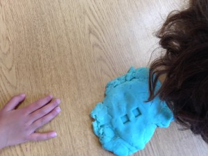 making math equations in my play dough with number stamps and dice